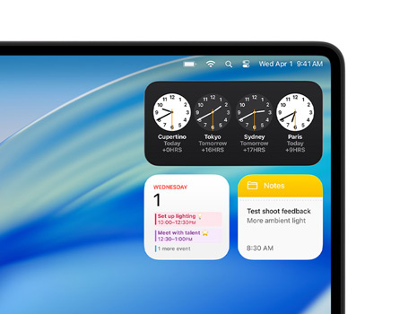 Un bureau de Mac affiche macOS Tahoe ainsi que divers widgets, notamment Horloge, Calendrier et Notes.