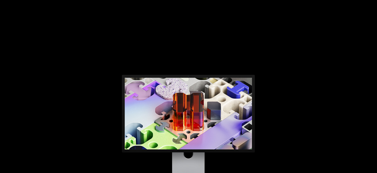 Front of Studio Display XDR with a three-dimensional puzzle-like wallpaper
