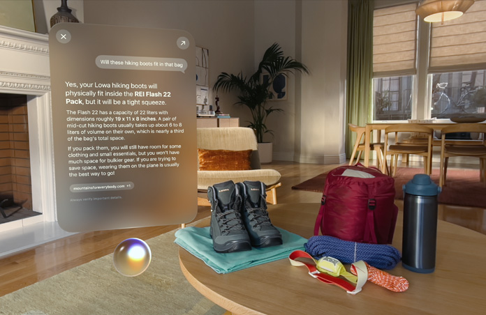 Answer to a query for Siri about packing camping essentials hovers above Siri Orb on left side of screen, hiking boots, ropes, backpack, water bottle, and head lamp sit on table on right side of screen