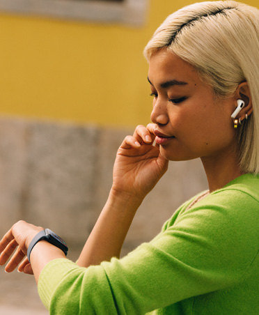 Woman looking at her Apple Watch